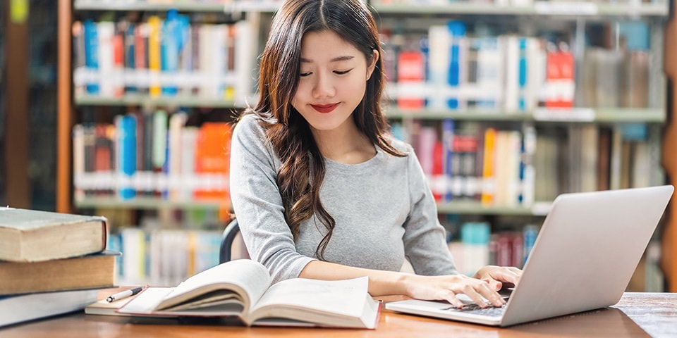 asian-young-student-casual-suit-doing-homework-using-technology-laptop-library-university_20251010194835511.jpg